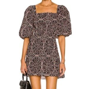 Alexis black dress with White and red Patterns